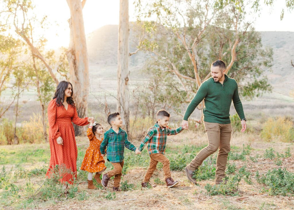 family holding hands while walking