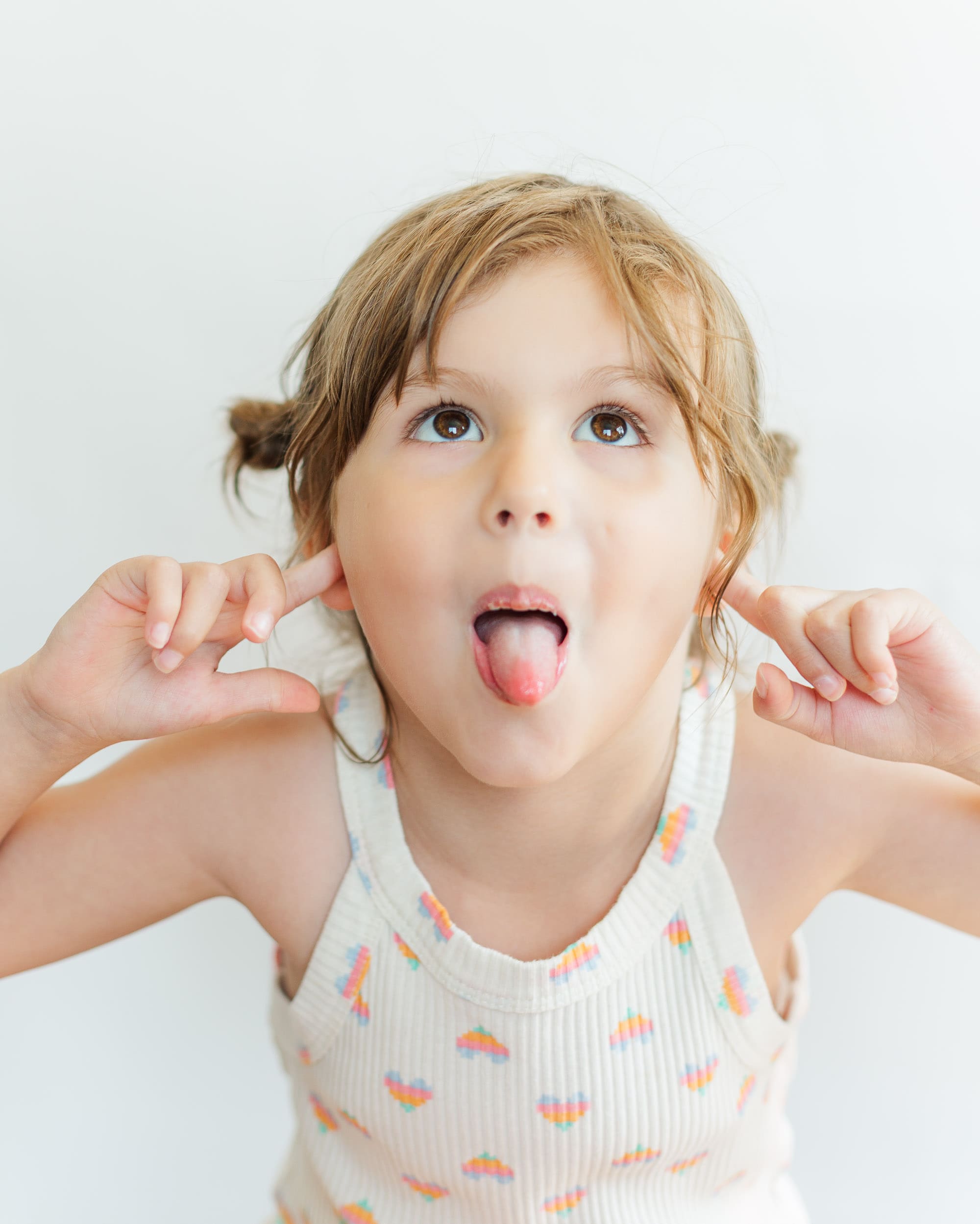 silly portrait of a girl sticking out her tongue
