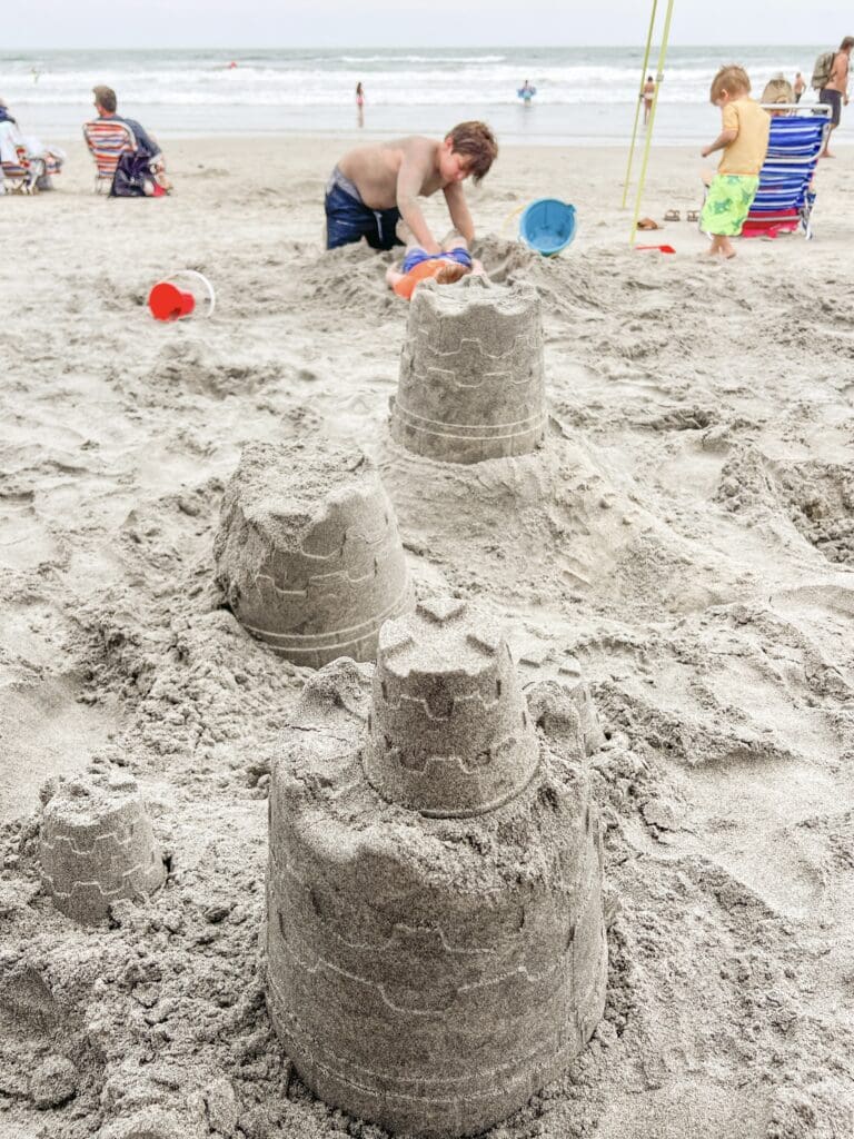 Making sandcastles at the beach.