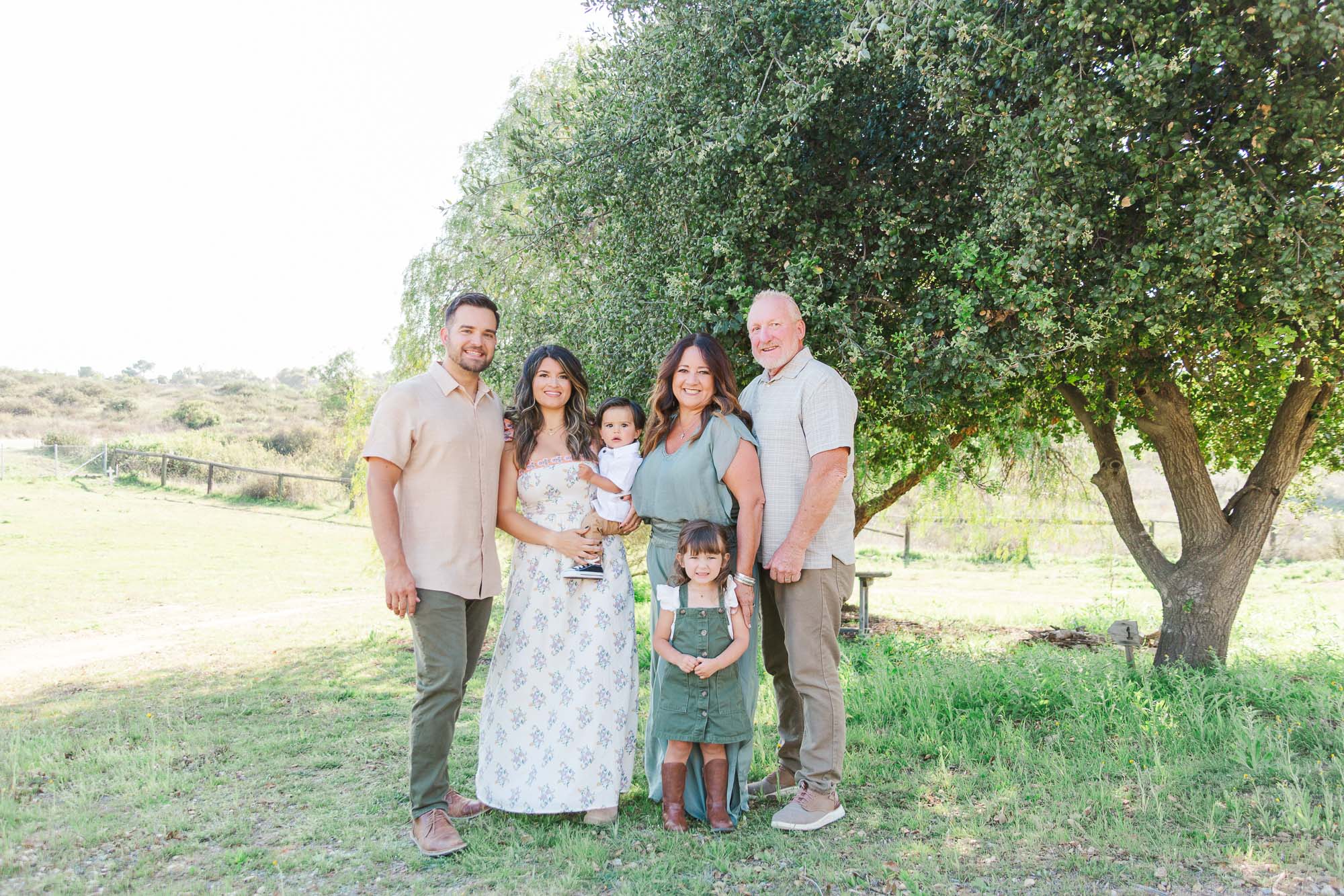Extend family picture with mom and dad, their daughter and son and grandparents.