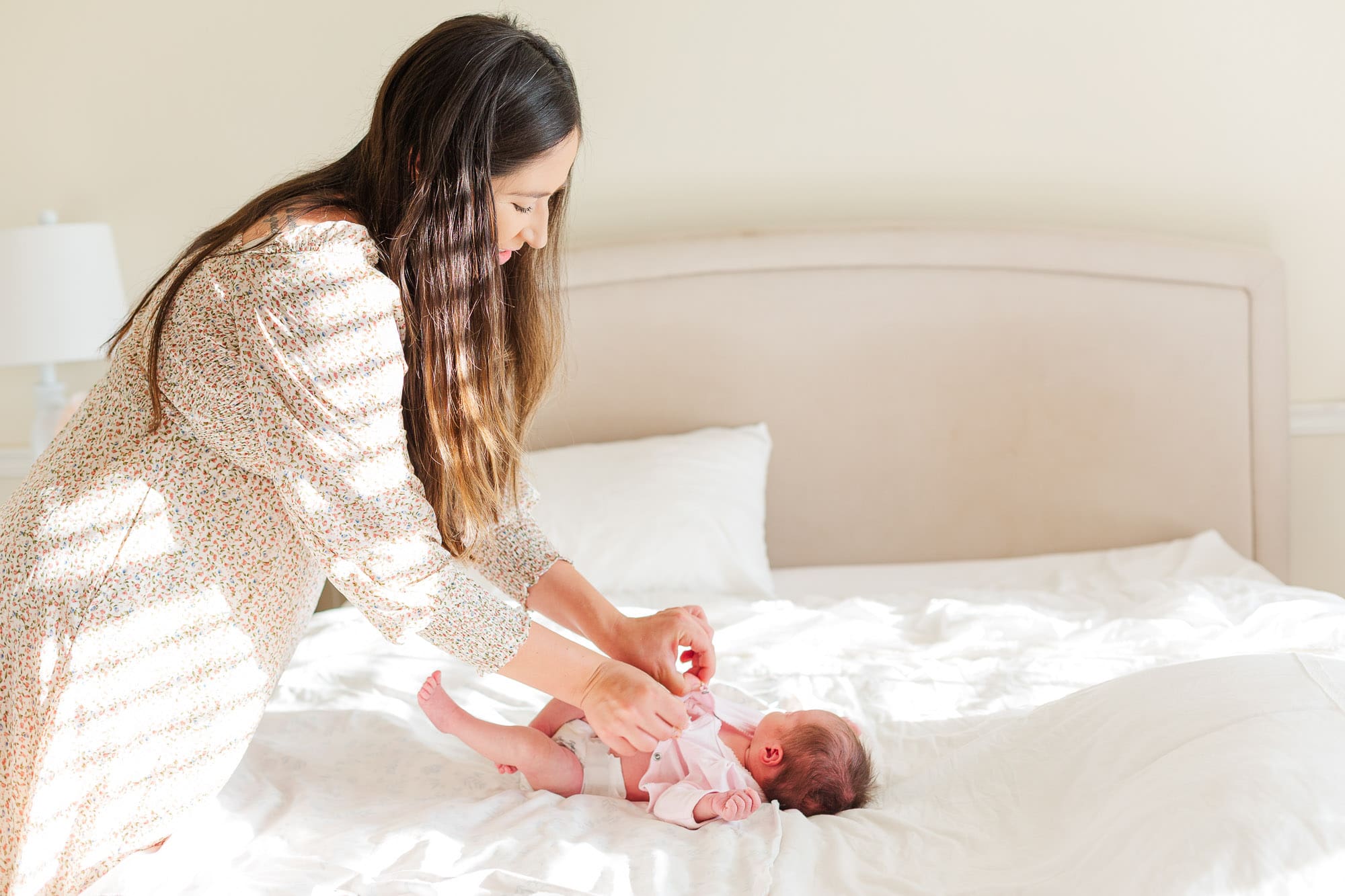 A mother holding her baby close, capturing an authentic moment of connection over perfection in Temecula.