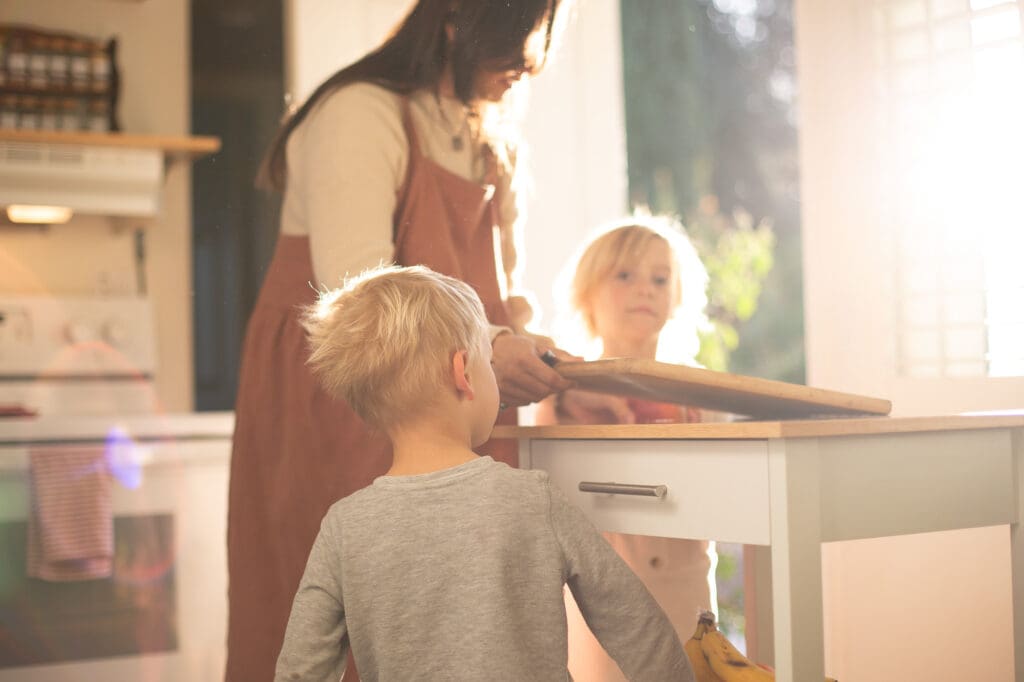 Murrieta lifestyle family photographer capturing natural light and authentic moments in a bright, cozy kitchen.